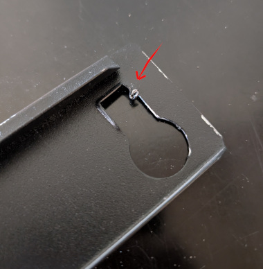 A keyhole cutout in the end of a beam.